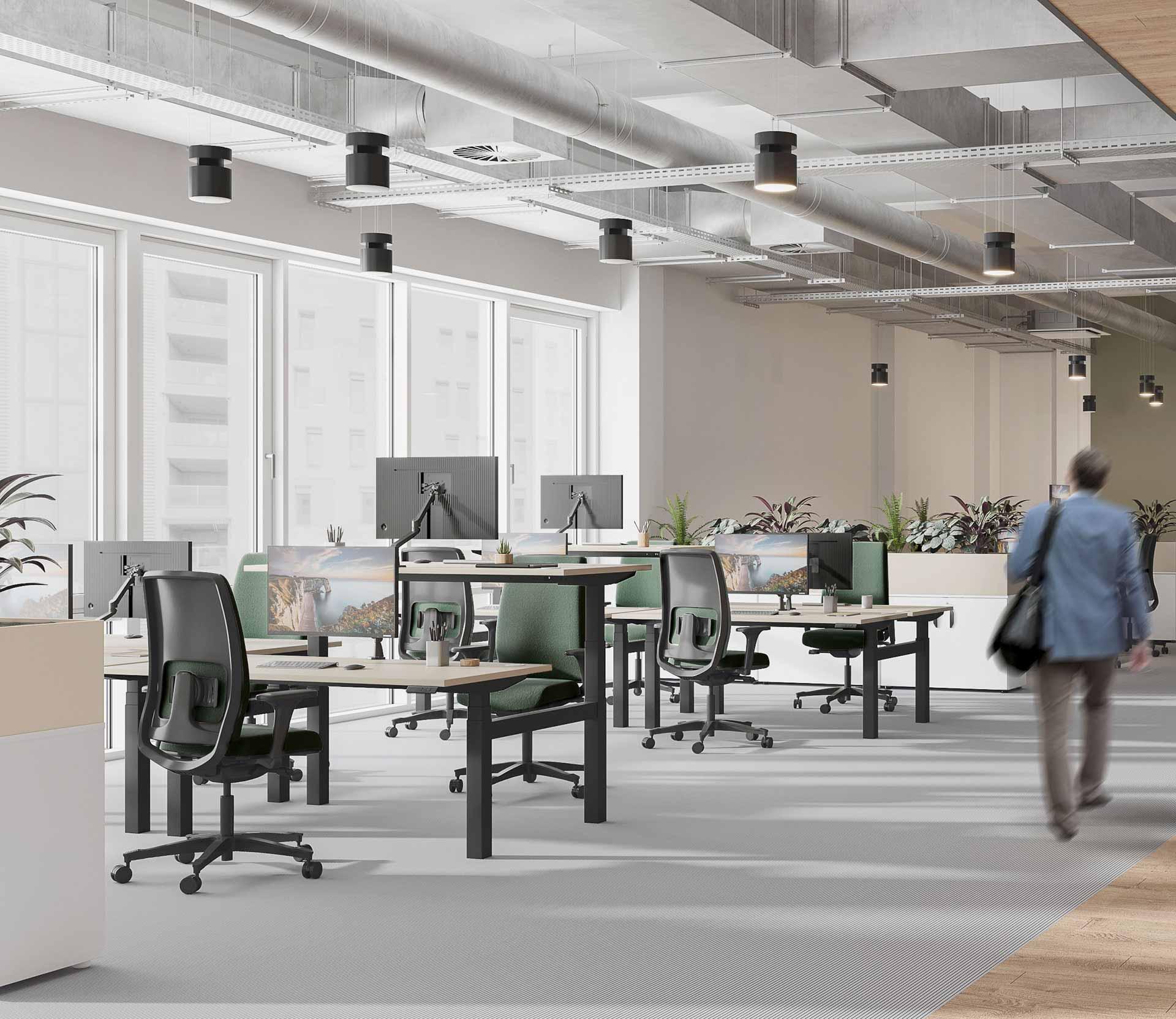 Open space avec bureau assis debout ergonomique